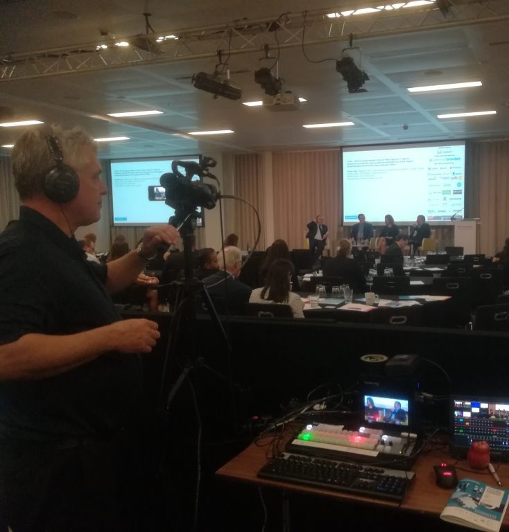 Photo of John Allard livestreaming a business event