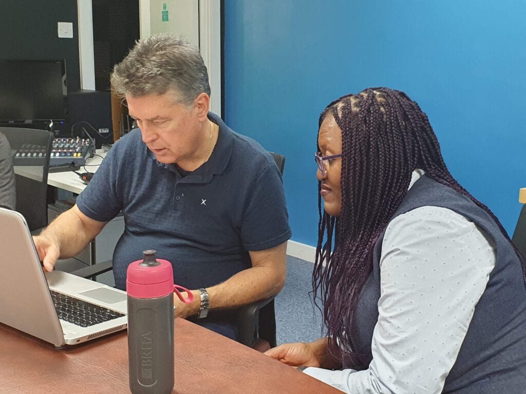 Photo of John Allard and Susan Popoola planning the autocue